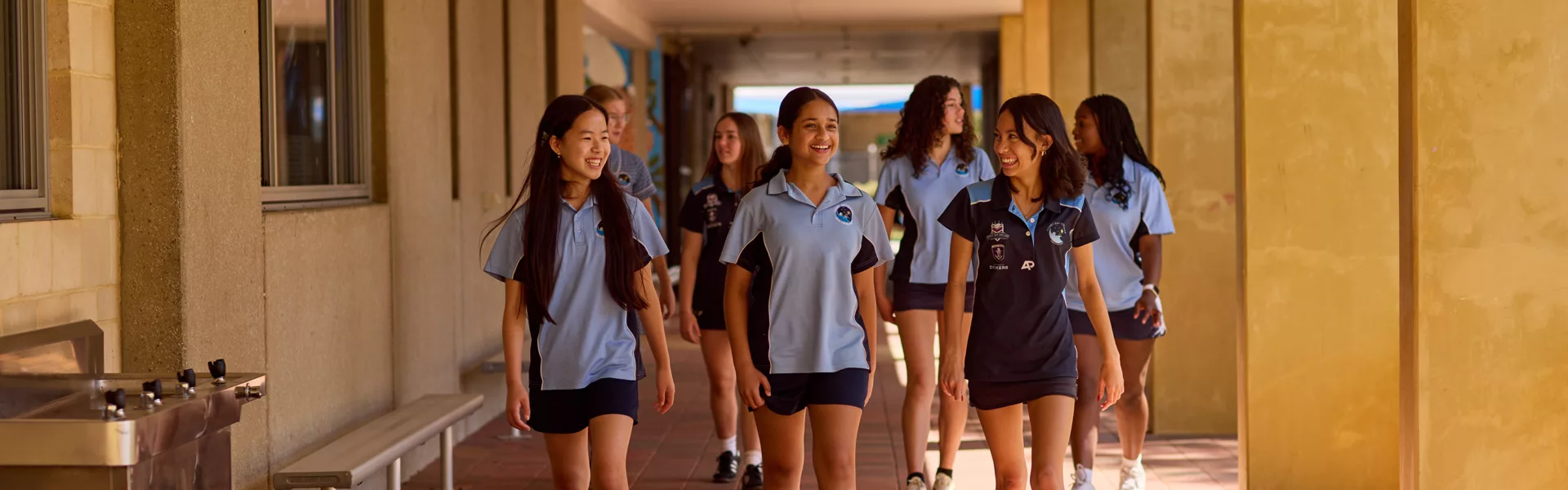 Girl group walking verandah }}