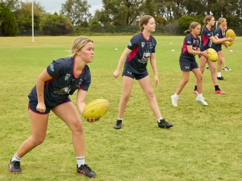 Football girls handballing }}