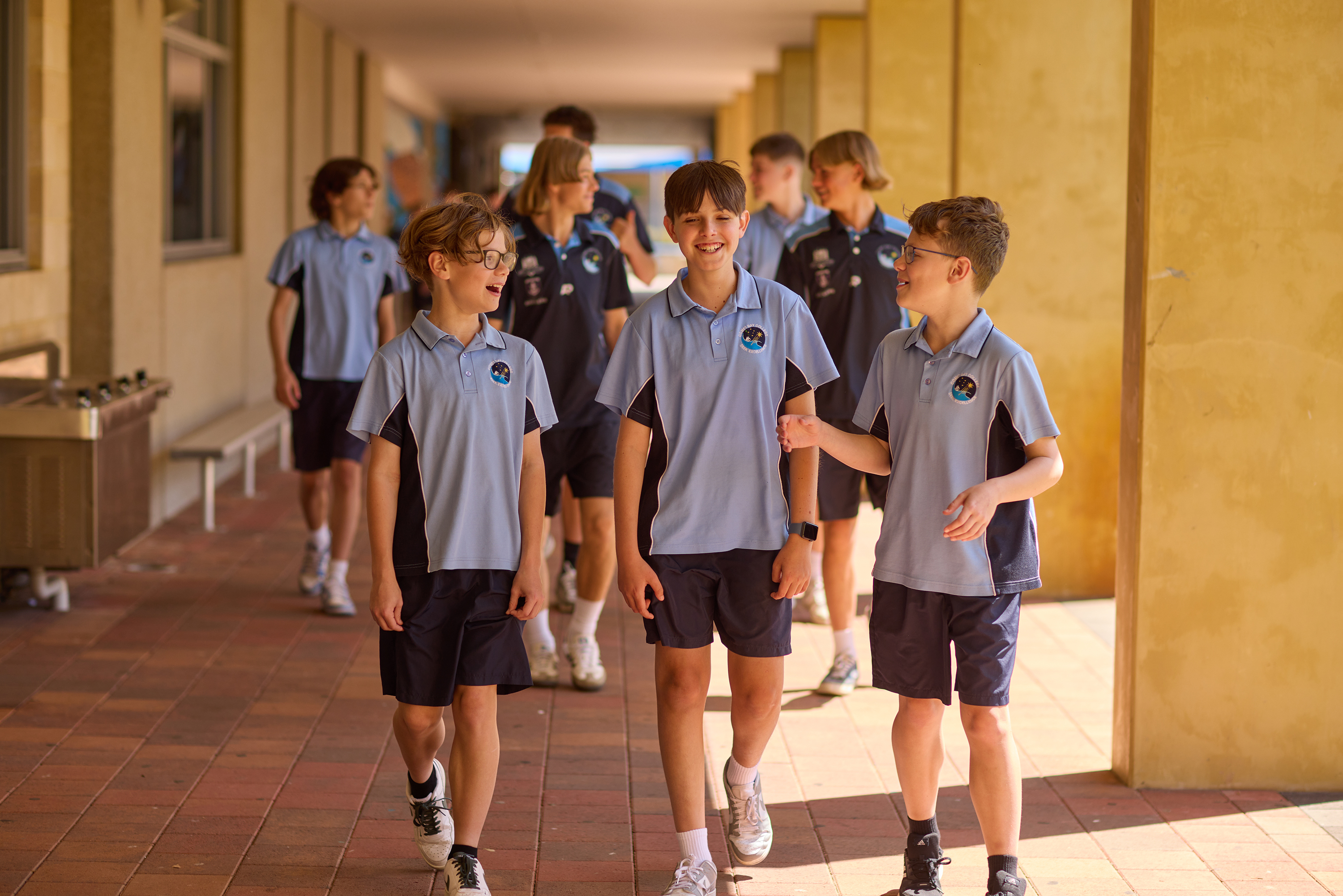 Boy group walking verandah }}